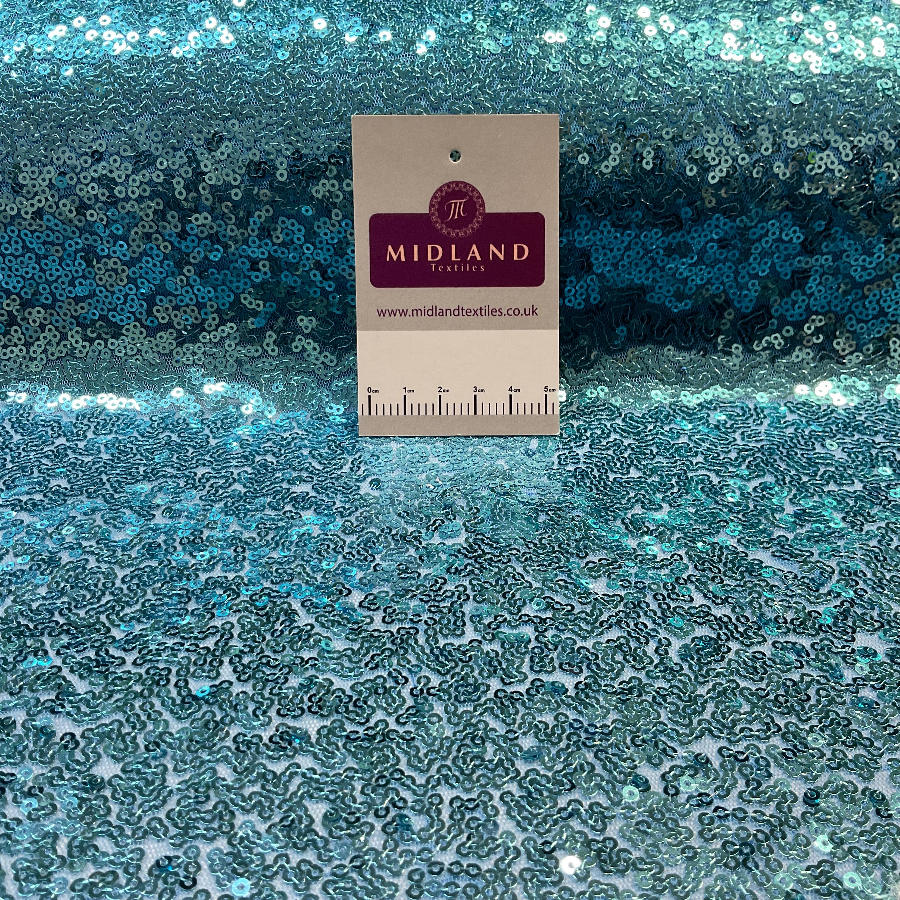 SENSATIONAL 3MM SEW ON ALL OVER SEQUINS ON NET FABRIC 50