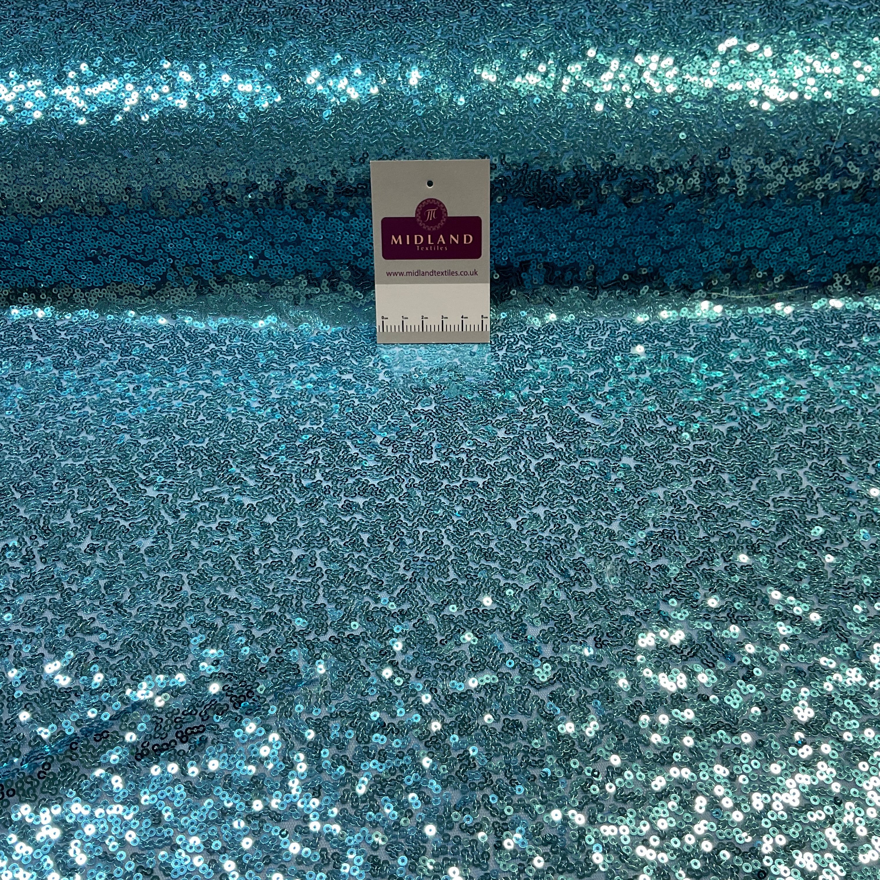 SENSATIONAL 3MM SEW ON ALL OVER SEQUINS ON NET FABRIC 50