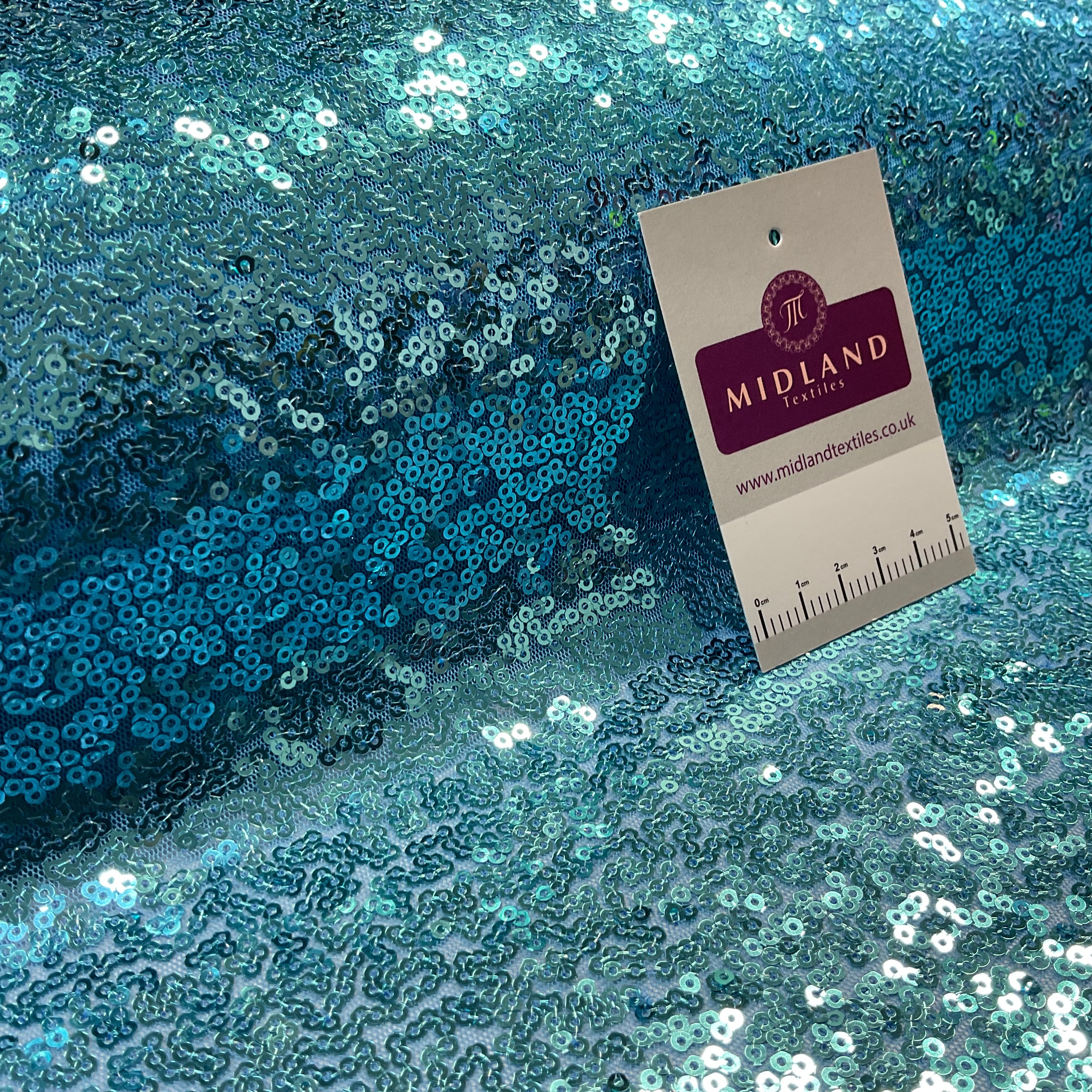 SENSATIONAL 3MM SEW ON ALL OVER SEQUINS ON NET FABRIC 50