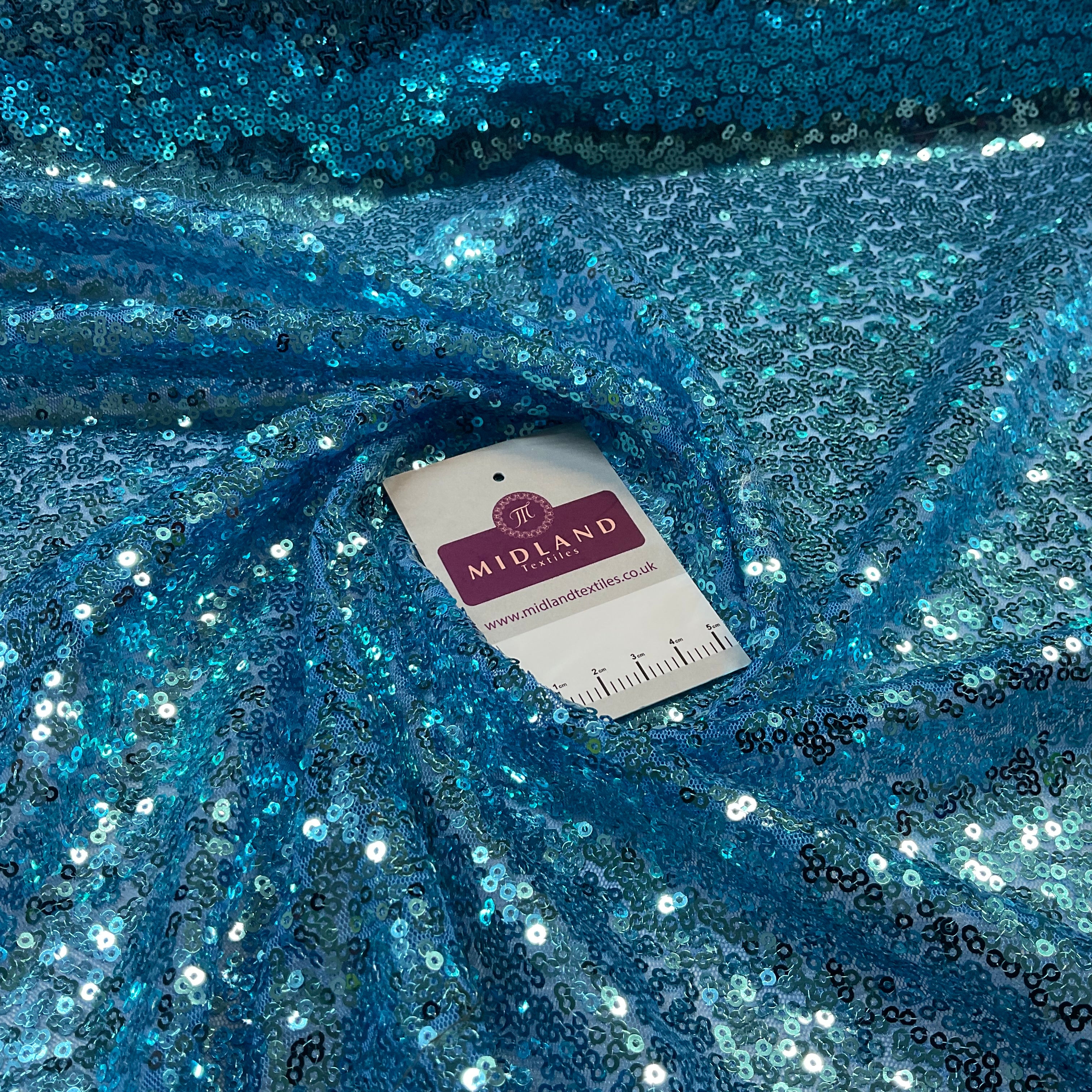 SENSATIONAL 3MM SEW ON ALL OVER SEQUINS ON NET FABRIC 50' WIDE DRESS FABRIC M1797 MTEX