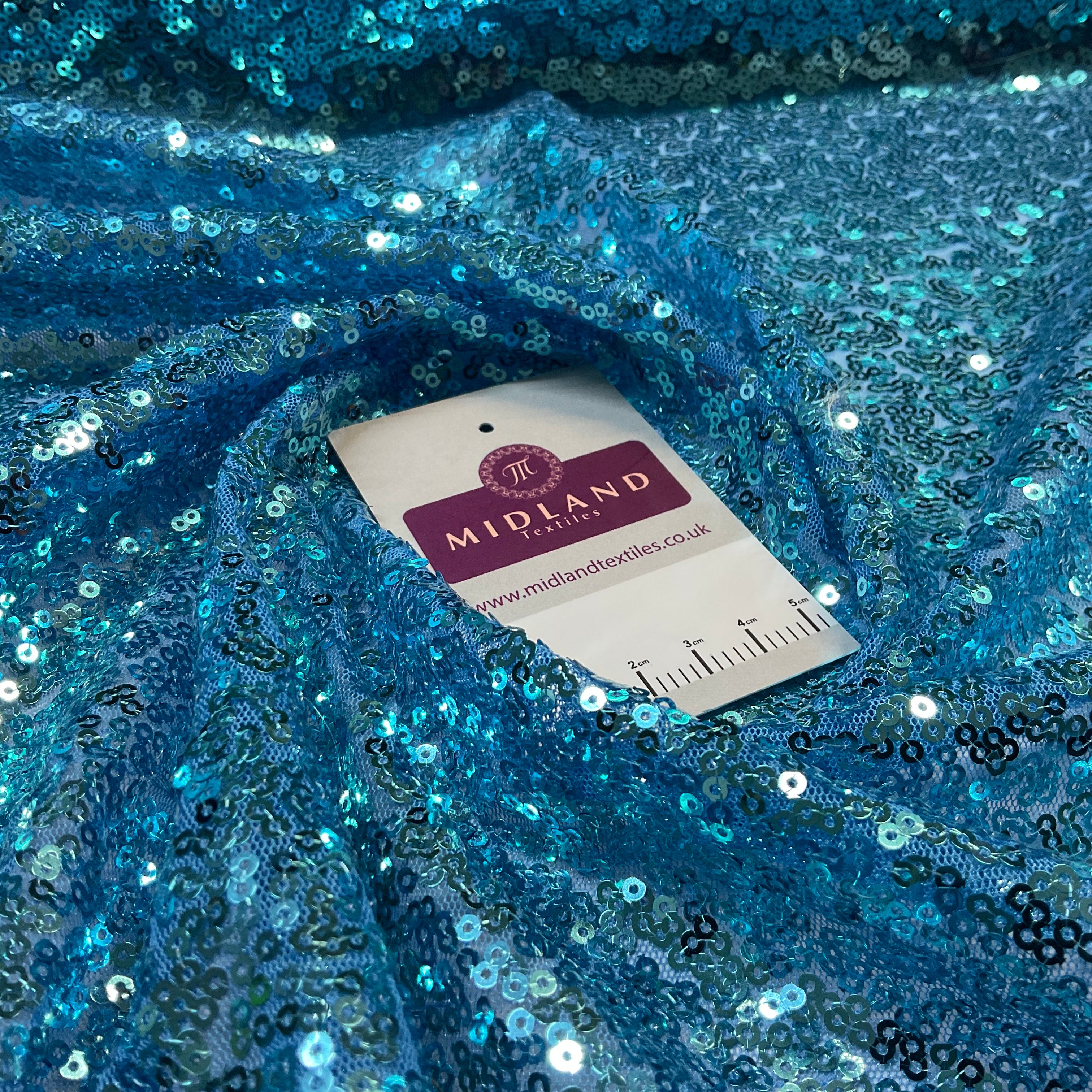 SENSATIONAL 3MM SEW ON ALL OVER SEQUINS ON NET FABRIC 50