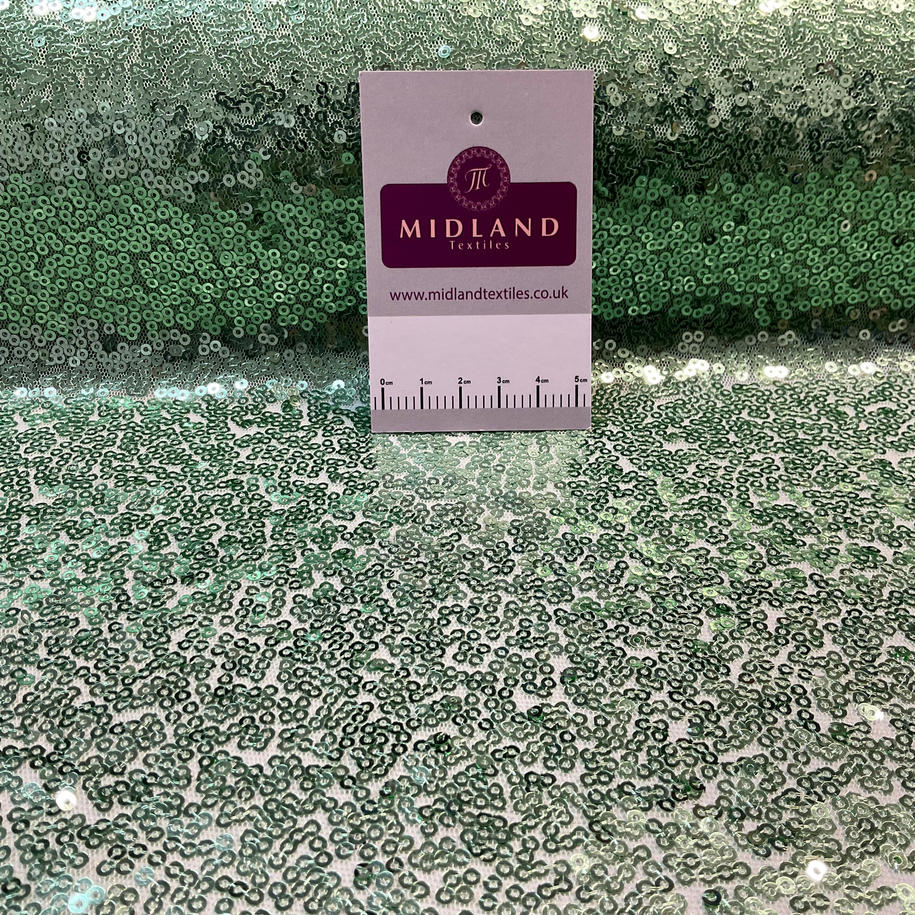 SENSATIONAL 3MM SEW ON ALL OVER SEQUINS ON NET FABRIC 50