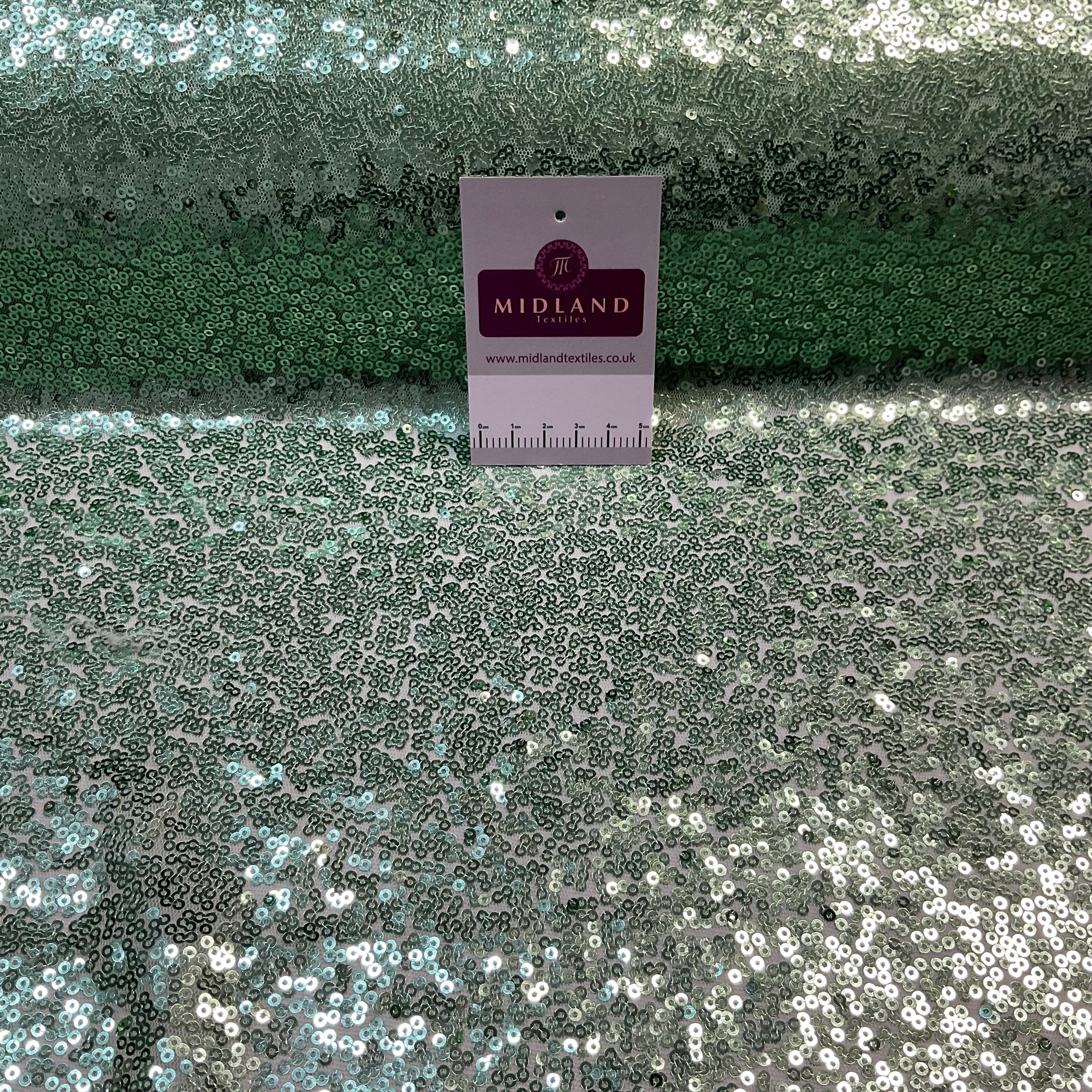 SENSATIONAL 3MM SEW ON ALL OVER SEQUINS ON NET FABRIC 50' WIDE DRESS FABRIC M1797 MTEX