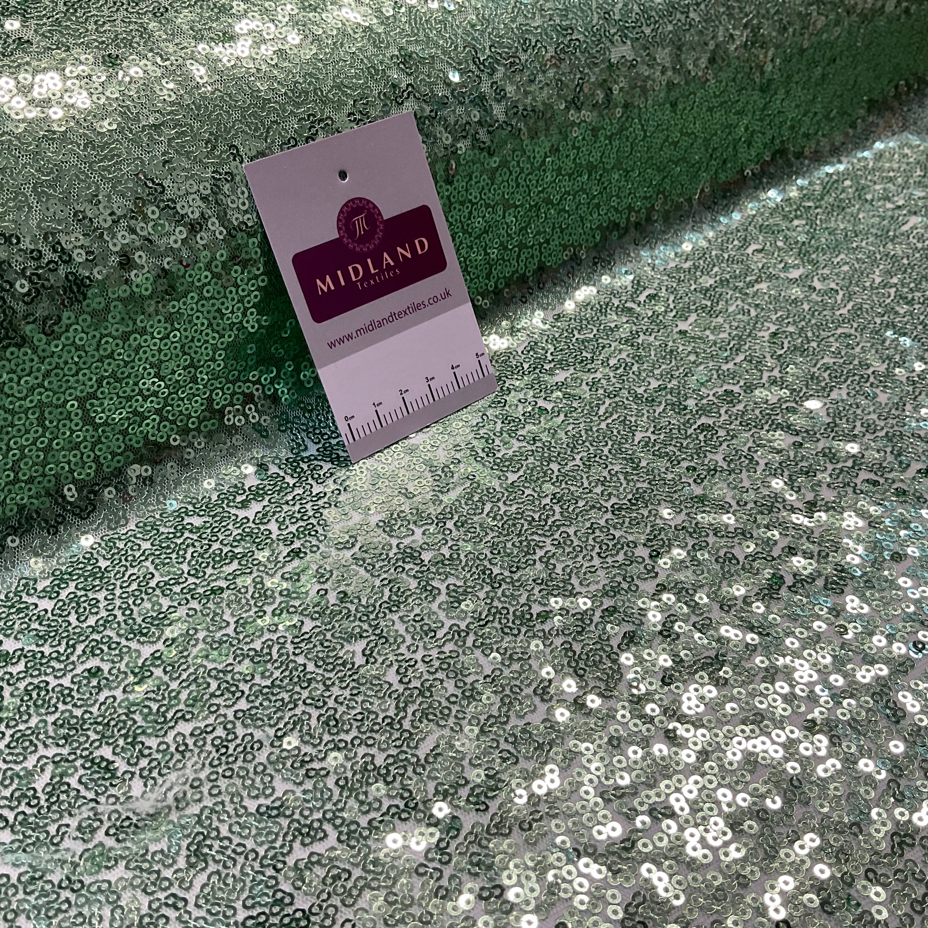 SENSATIONAL 3MM SEW ON ALL OVER SEQUINS ON NET FABRIC 50