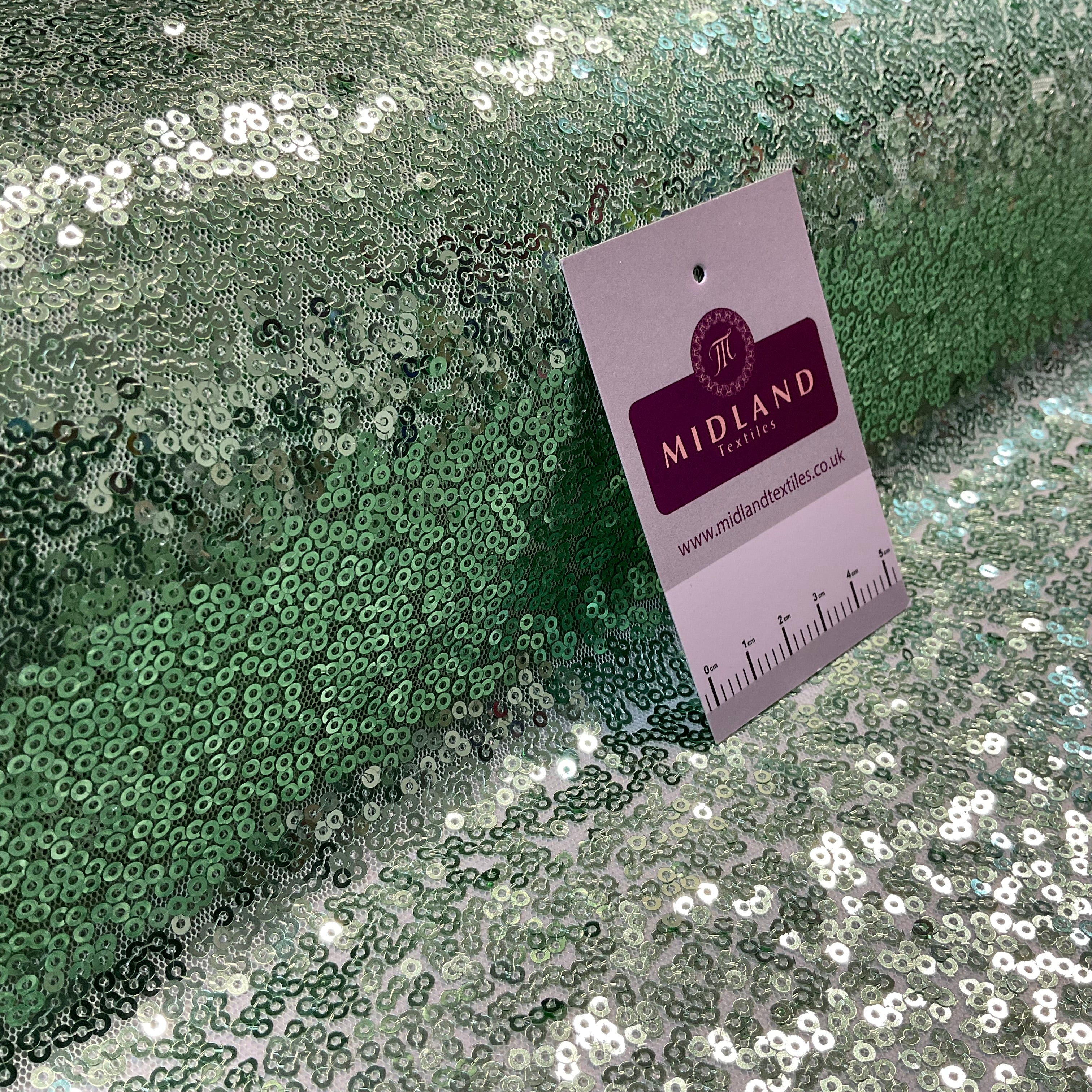 SENSATIONAL 3MM SEW ON ALL OVER SEQUINS ON NET FABRIC 50