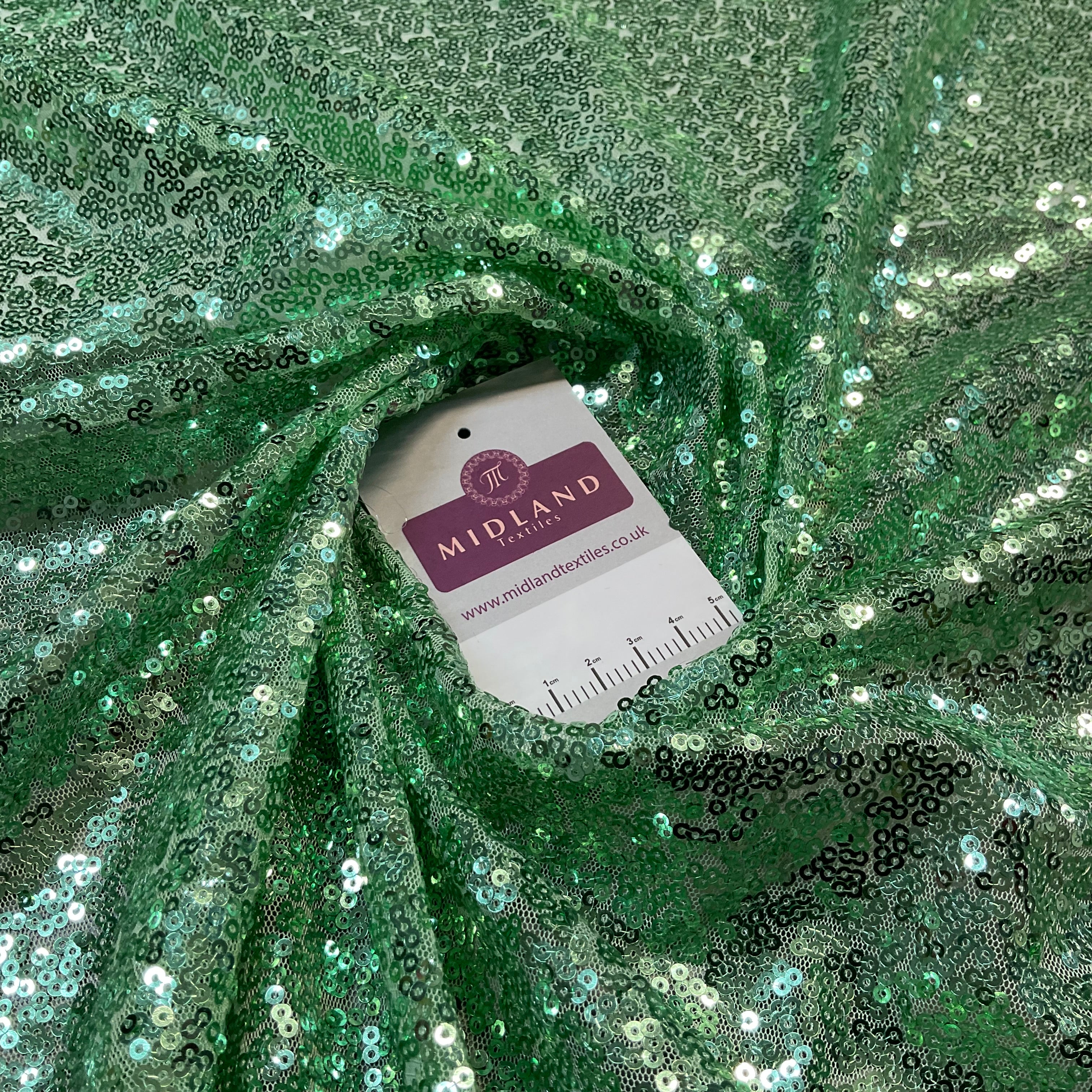 SENSATIONAL 3MM SEW ON ALL OVER SEQUINS ON NET FABRIC 50' WIDE DRESS FABRIC M1797 MTEX