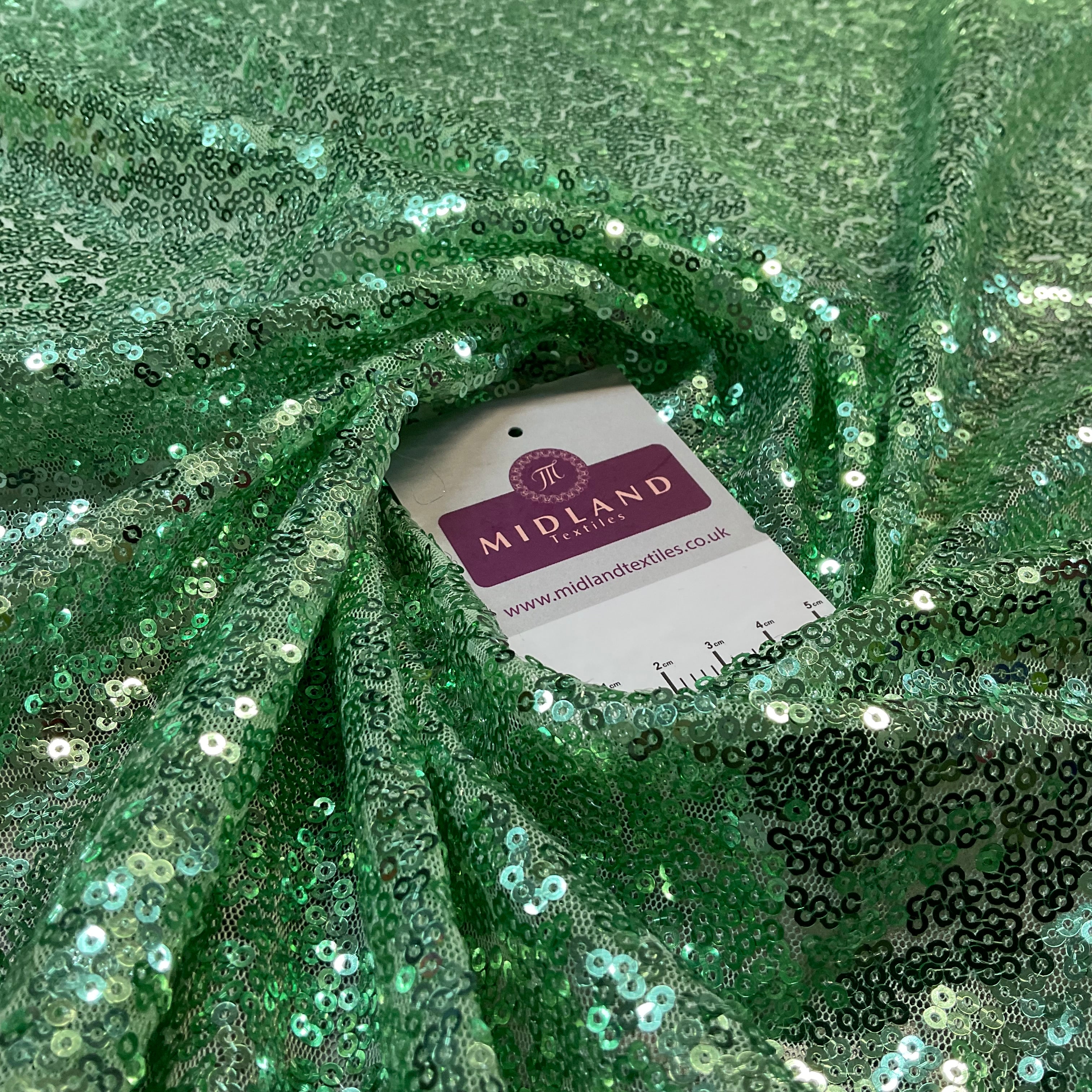 SENSATIONAL 3MM SEW ON ALL OVER SEQUINS ON NET FABRIC 50