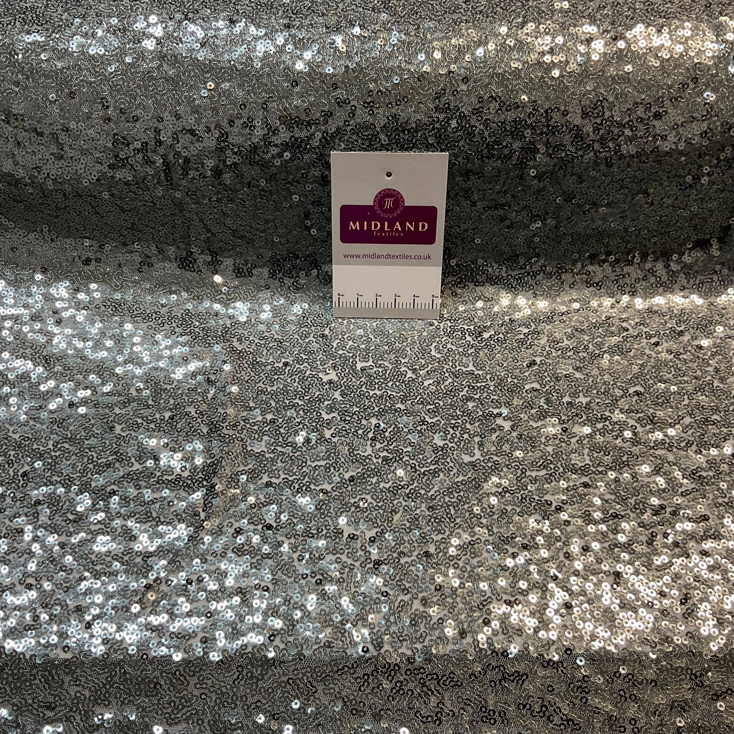 SENSATIONAL 3MM SEW ON ALL OVER SEQUINS ON NET FABRIC 50