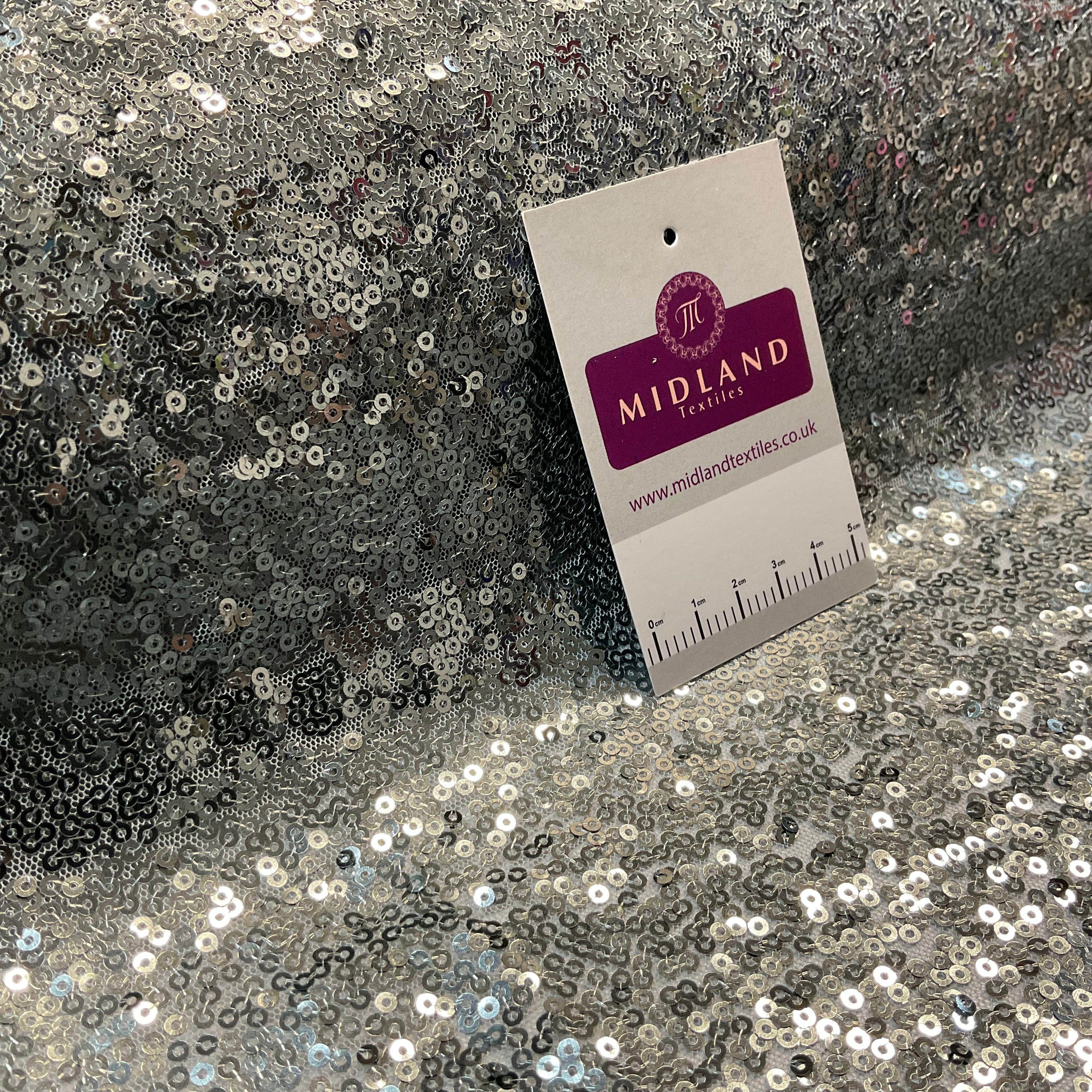 SENSATIONAL 3MM SEW ON ALL OVER SEQUINS ON NET FABRIC 50' WIDE DRESS FABRIC M1797 MTEX