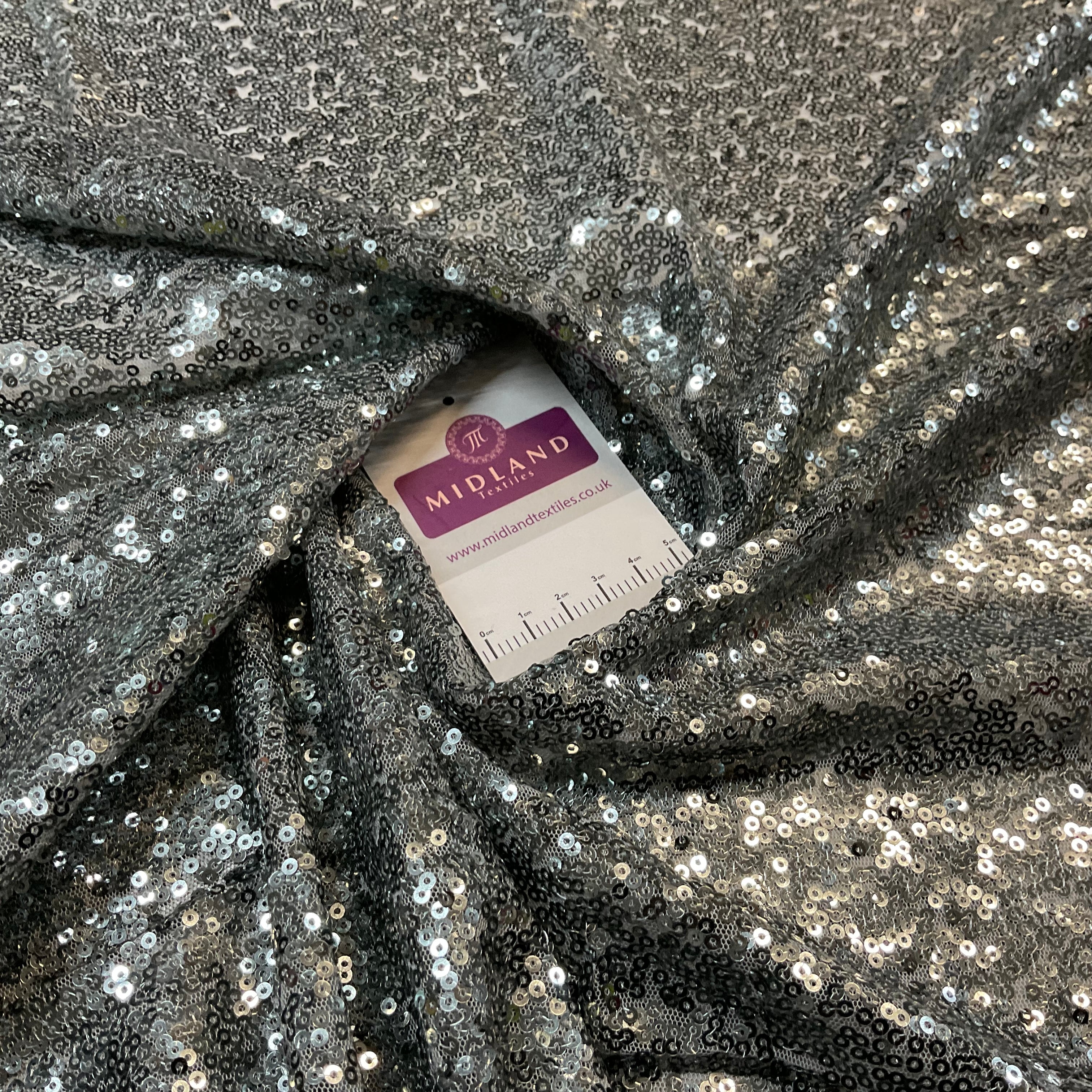 SENSATIONAL 3MM SEW ON ALL OVER SEQUINS ON NET FABRIC 50