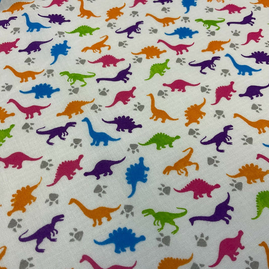 £2.50/m White Tiny Dinosaurs  Children's Poly cotton printed fabric M1637