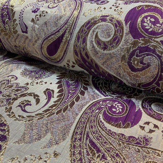 Close-up of purple and gold paisley patterned fabric