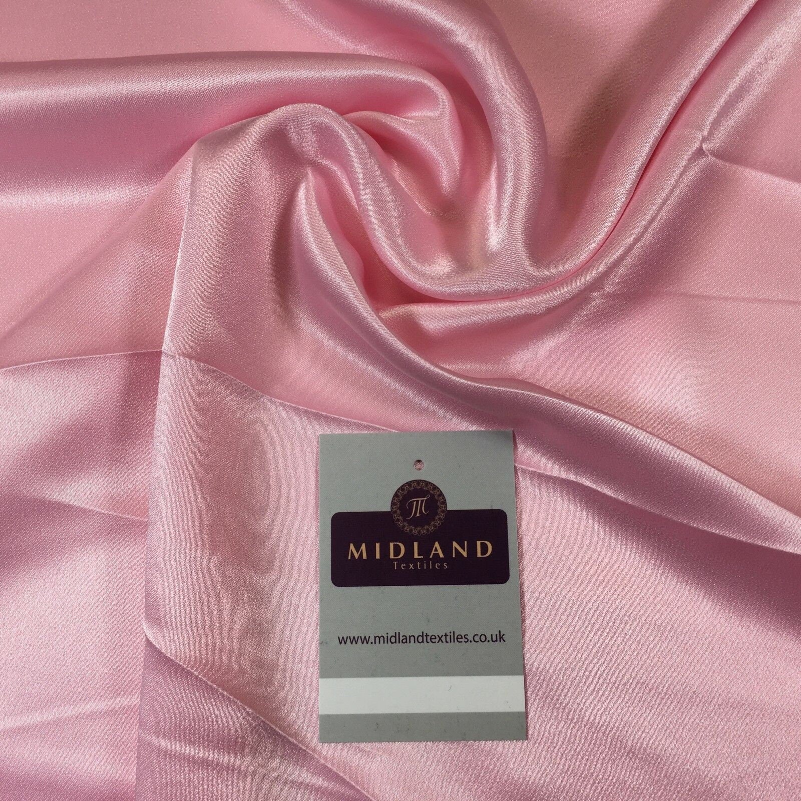 A collection of 20 different colors of silky smooth crepe back liquid satin fabric.