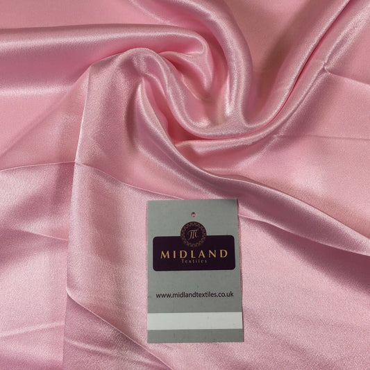 A collection of 20 different colors of silky smooth crepe back liquid satin fabric.