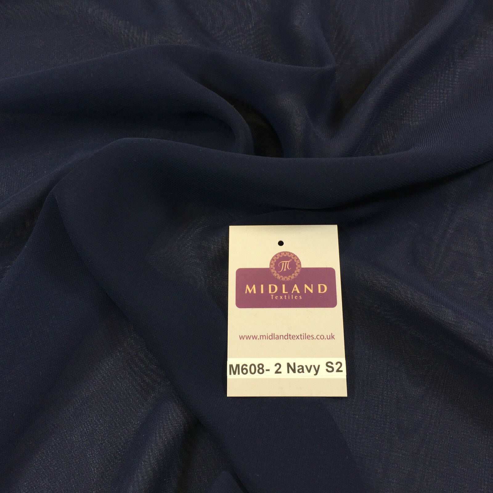 A collection of Hi-Multi Caress Chiffon Sheer Fabric in various colors, displayed on a pink background with a label showing the brand name 'MIDLAND'.