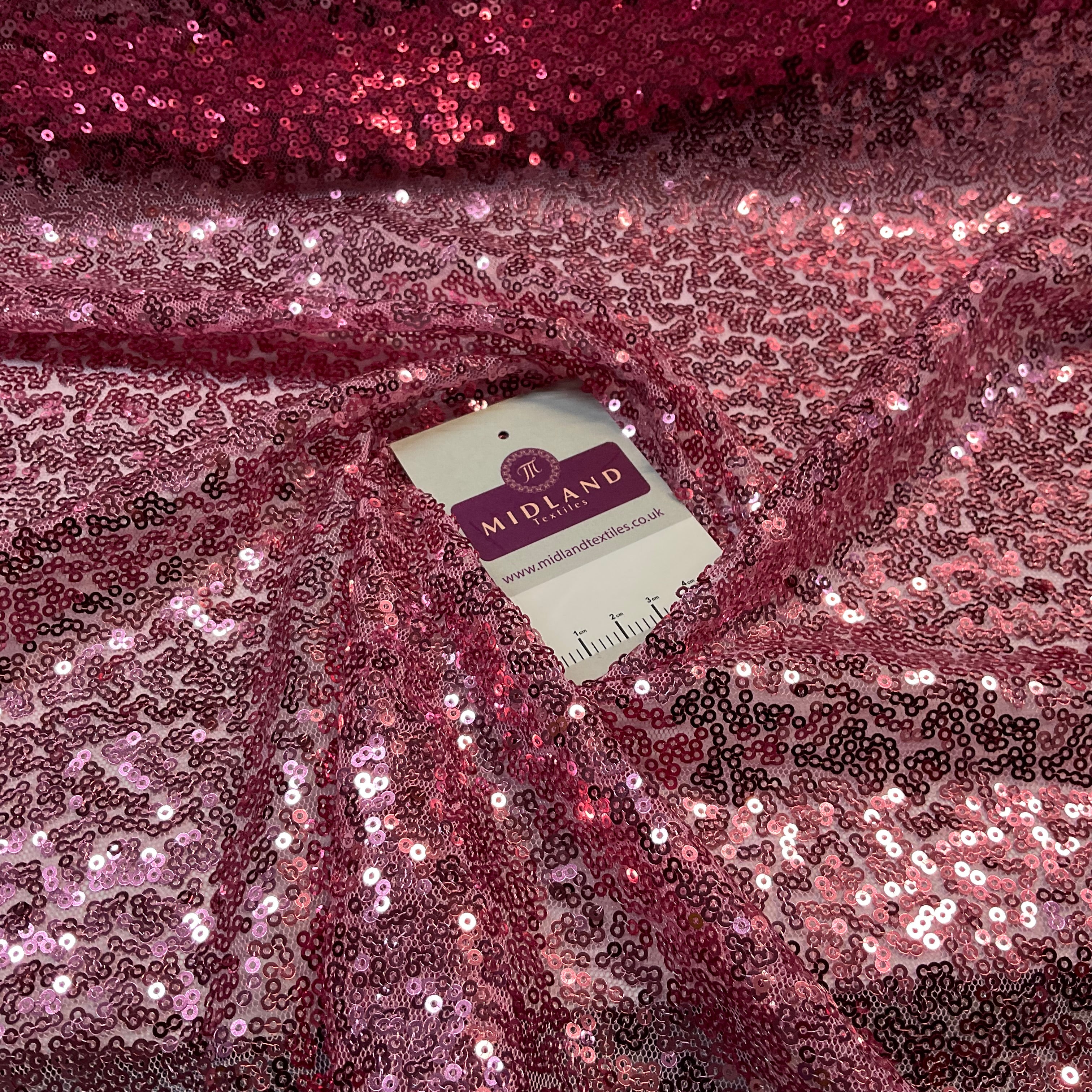 SENSATIONAL 3MM SEW ON ALL OVER SEQUINS ON NET FABRIC 50