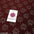 Burgundy floral lace fabric with glitter details, ideal for dressmaking and crafts