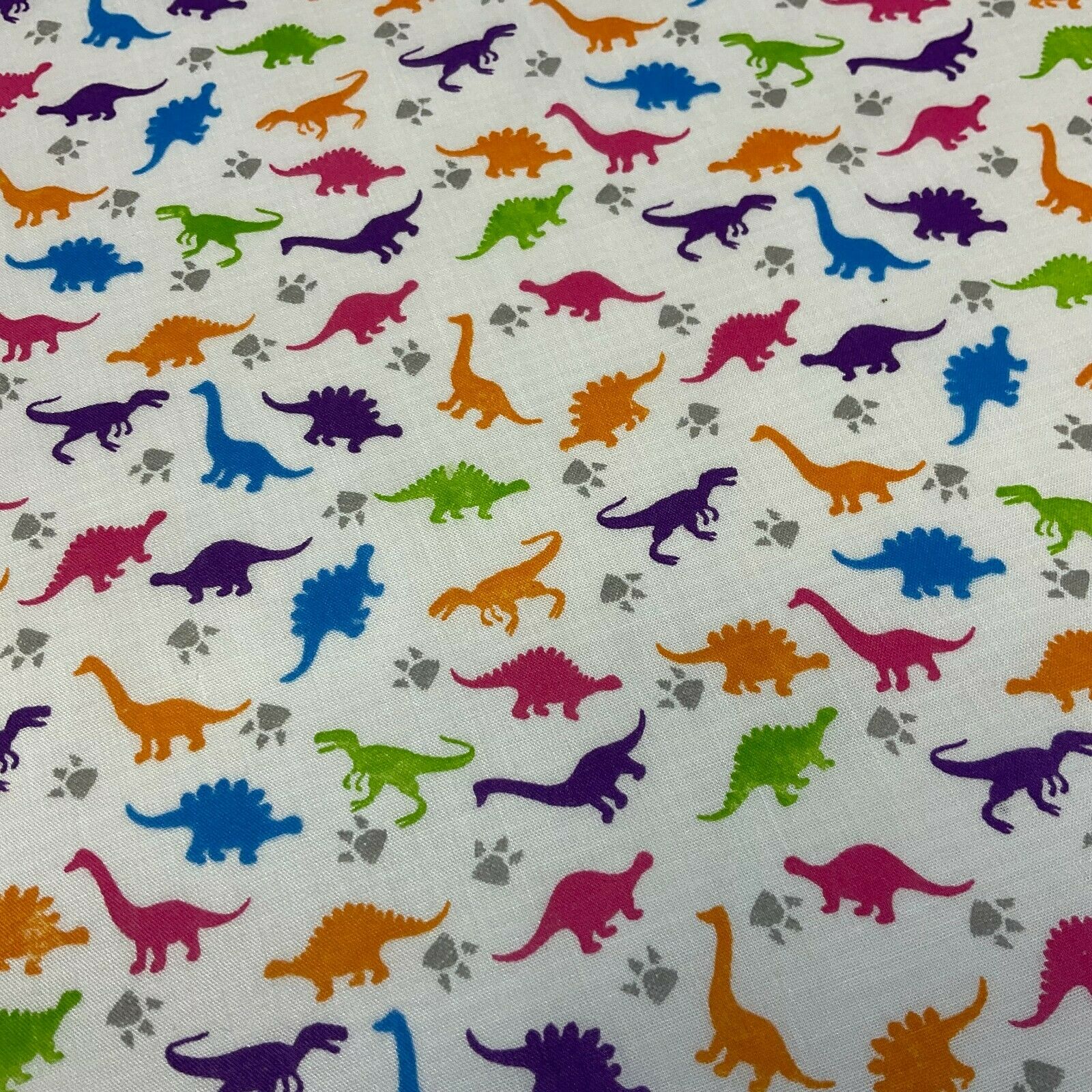 White Tiny Dinosaurs  Children's Poly cotton printed lightweight fabric M1637
