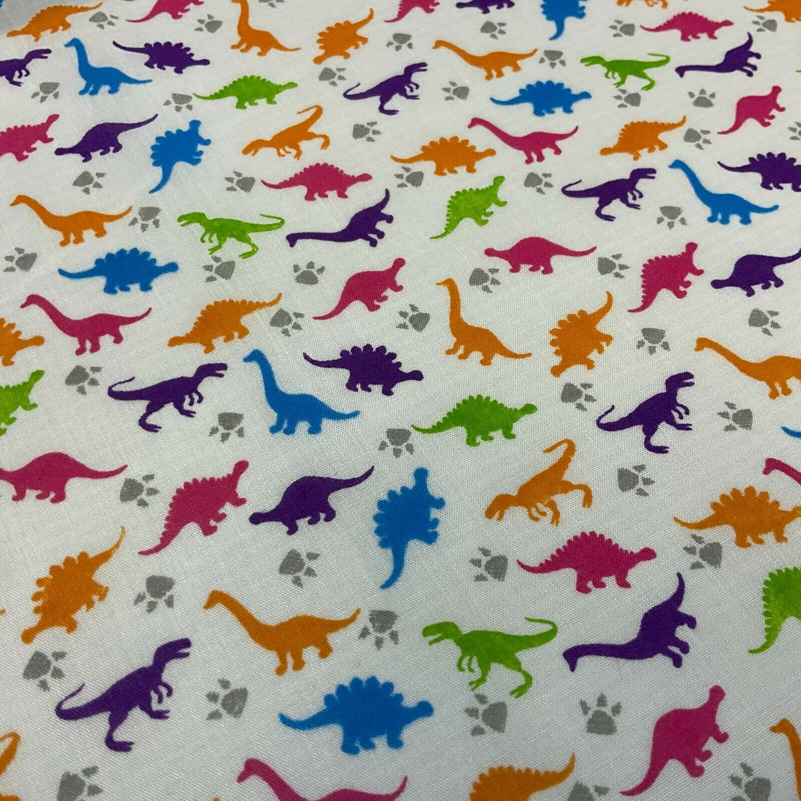 White Tiny Dinosaurs  Children's Poly cotton printed lightweight fabric M1637