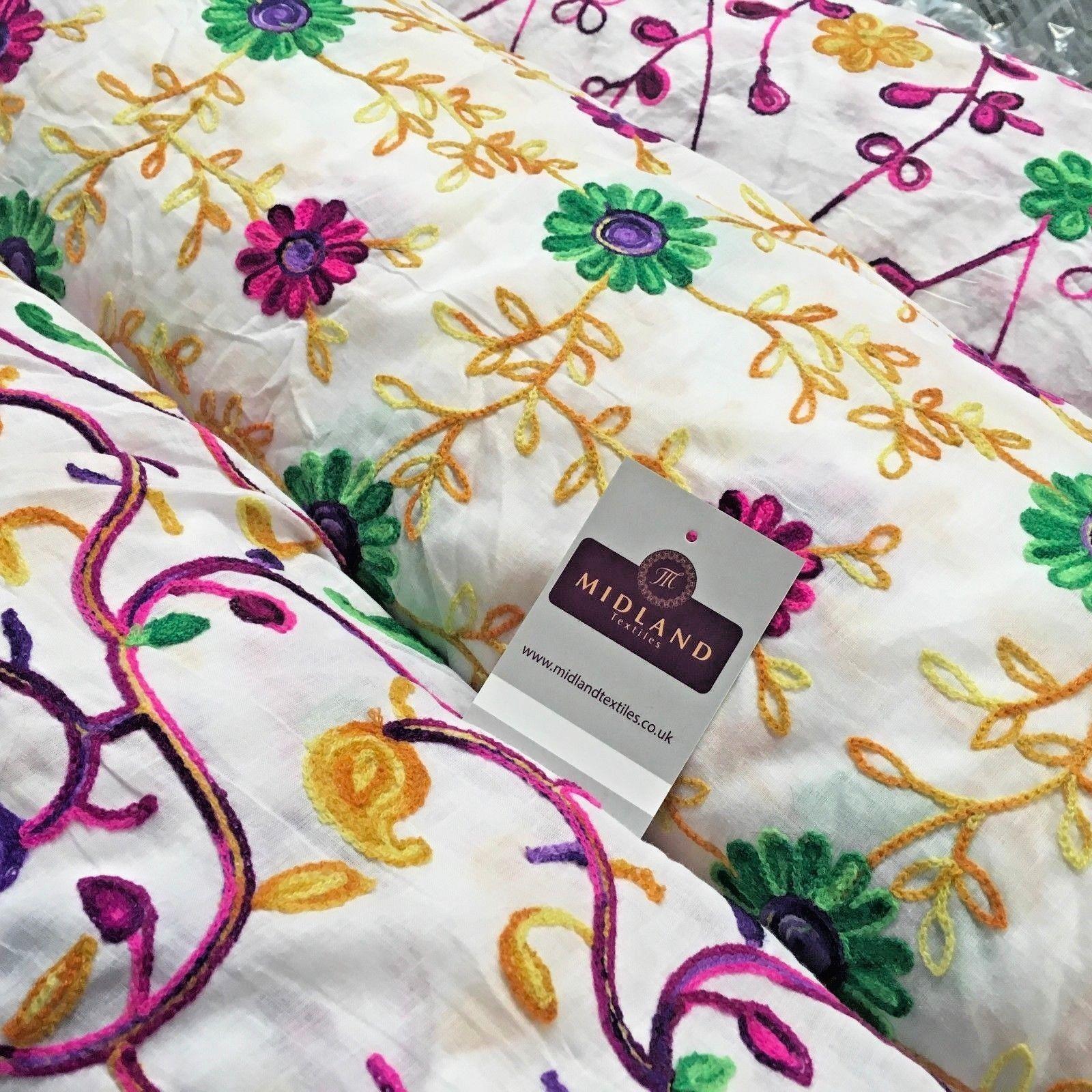 White Cotton with multicoloured wool embroidered dress fabric 54' Wide M1000