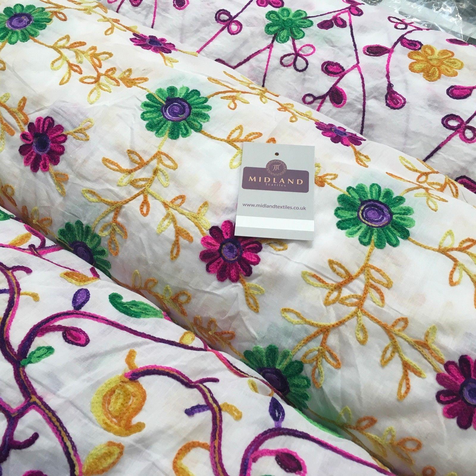 White Cotton with multicoloured wool embroidered dress fabric 54' Wide M1000
