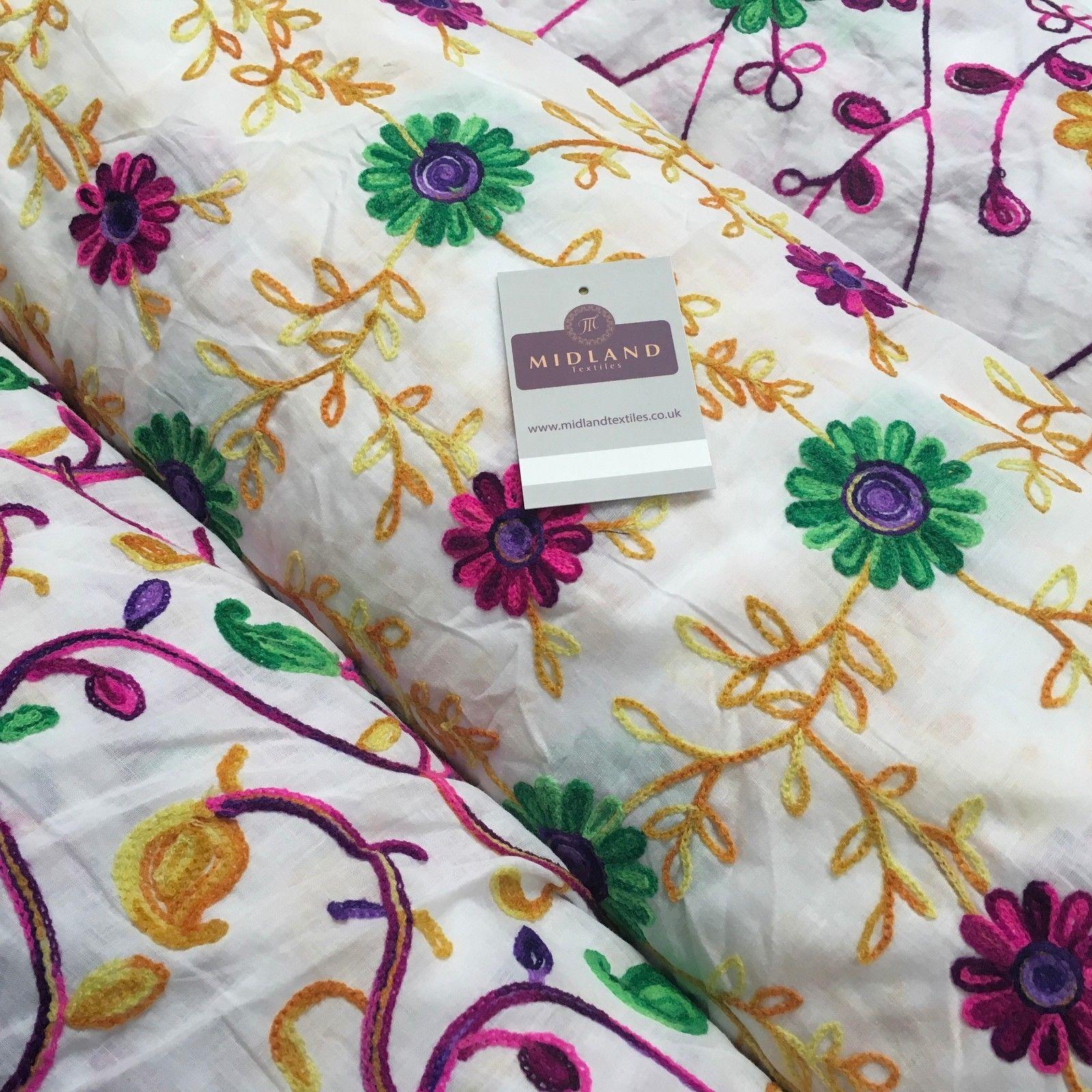 White Cotton with multicoloured wool embroidered dress fabric 54" Wide White Cotton with multicoloured wool embroidered dress fabric 54" Wide