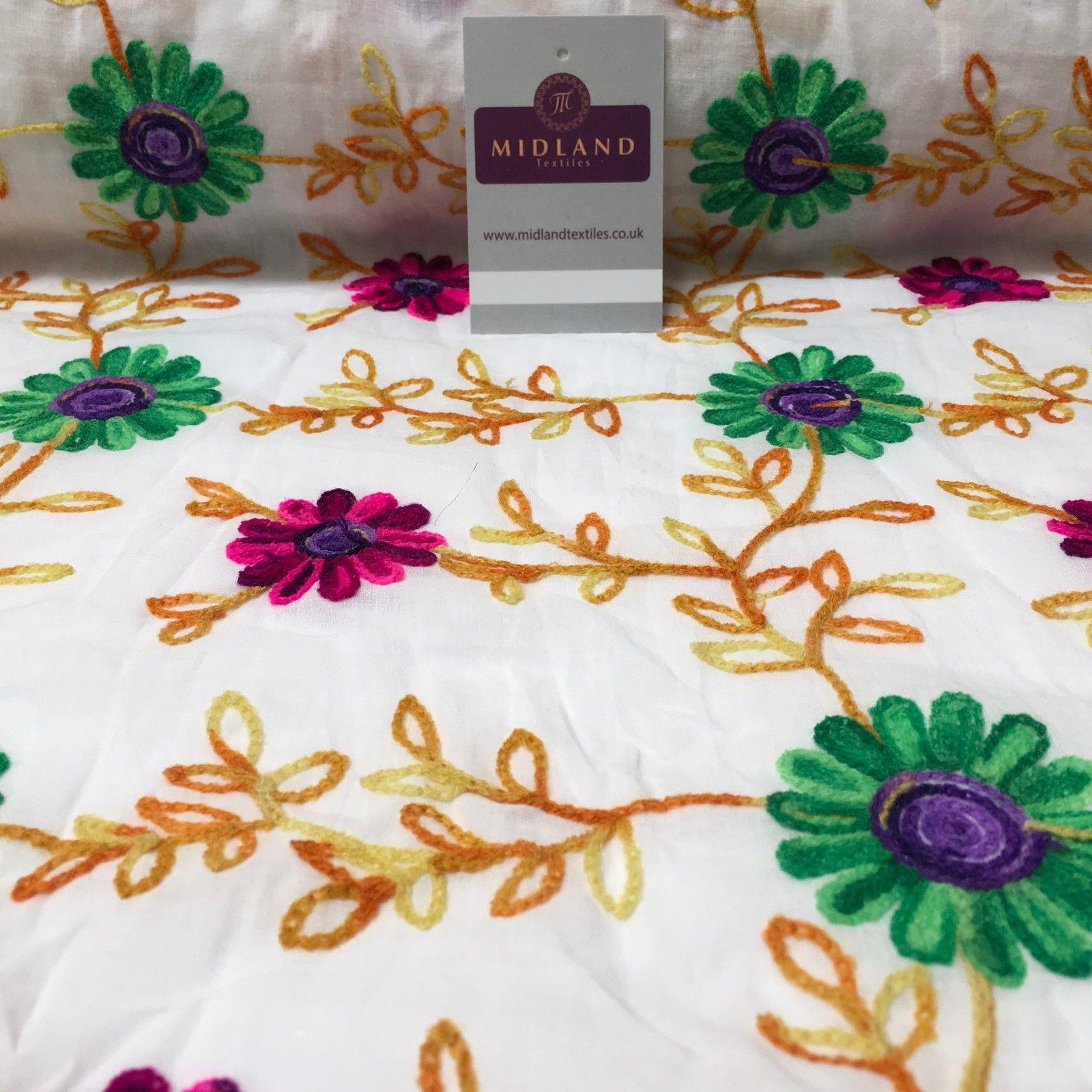 White Cotton with multicoloured wool embroidered dress fabric 54' Wide M1000